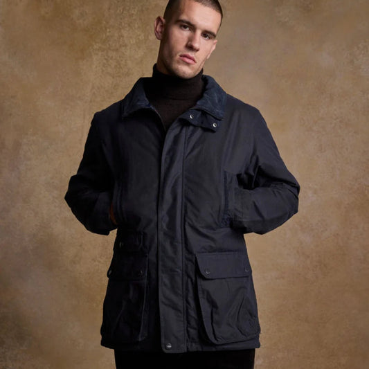 Man wearing a navy waxed cotton jacket