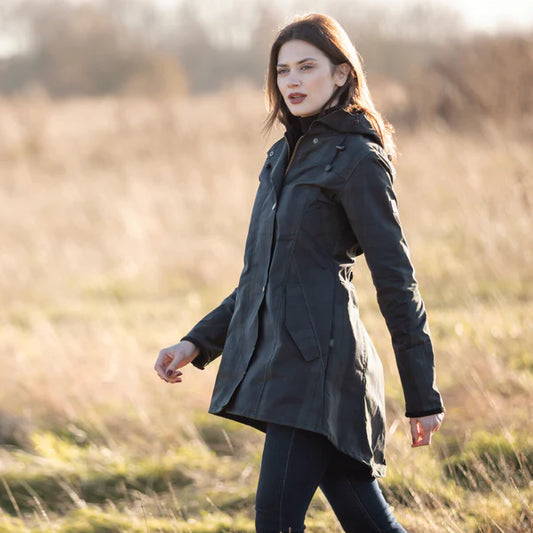 Woman wearing an Oxford Blue Katrina waxed cotton jacket in Black Watch