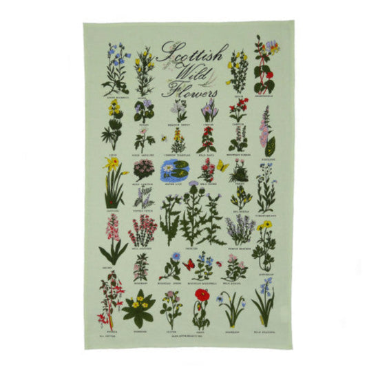 Tea towel with illustrations of Scottish wild flowers on a green background